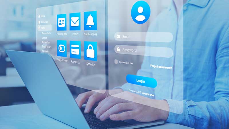 Homem no computador com ícones de dados pessoais à volta